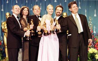 (l-r) David Parfitt, Donna Gigliotti, Harvey Weinstein, Gwyneth Paltrow, Edward Zwick and Marc Norman all celebrate after receiving the Oscar for best picture for Shakespeare In Love. Gwyneth Paltrow also won the best Actress award   (Photo by Peter Jordan - PA Images/PA Images via Getty Images)