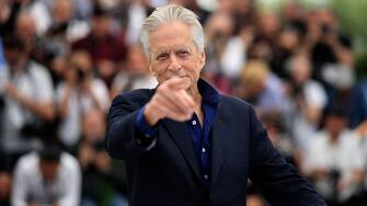 US actor and Honorary Palme d'or laureate Michael Douglas gestures during a photocall at the 76th edition of the Cannes Film Festival in Cannes, southern France, on May 16, 2023. (Photo by Valery HACHE / AFP) (Photo by VALERY HACHE/ AFP via Getty Images)