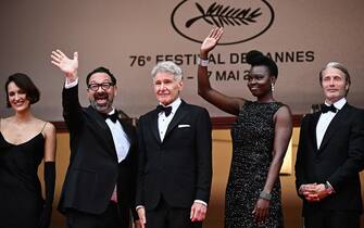 (From L) British actress Phoebe Waller-Bridge, US director James Mangold, US actor Harrison Ford, US actress Shaunette Renee Wilson and Danish actor Mads Mikkelsen arrives for the screening of the film "Indiana Jones and the Dial of Destiny" during the 76th edition of the Cannes Film Festival in Cannes, southern France, on May 18, 2023. (Photo by LOIC VENANCE / AFP) (Photo by LOIC VENANCE/AFP via Getty Images)