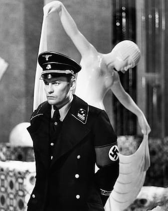 Austrian actor Helmut Berger acting in the film 'Salon Kitty'.  Rome, 1975 (Photo by Mondadori via Getty Images)
