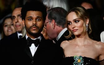 Canadian singer Abel Makkonen Tesfaye aka The Weeknd (L) and French-US actress Lily-Rose Depp arrive for the screening of the film "The Idol" during the 76th edition of the Cannes Film Festival in Cannes, southern France, on May 22, 2023. (Photo by CHRISTOPHE SIMON / AFP) (Photo by CHRISTOPHE SIMON/AFP via Getty Images)