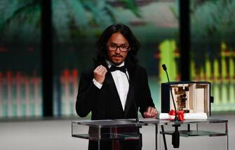 Cambodian director Pham An Thien delivers a speech on stage after he won the Camera d'Or for the film "L'Arbre aux Papillons d'Or" during the closing ceremony of the 76th edition of the Cannes Film Festival in Cannes, southern France, on May 27, 2023. (Photo by CHRISTOPHE SIMON / AFP) (Photo by CHRISTOPHE SIMON/AFP via Getty Images)