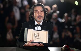 Japanese actor Koji Yakusho poses during a photocall with his trophy after he won the Best Actor Prize for his part in the film "Perfect Days" during the closing ceremony of the 76th edition of the Cannes Film Festival in Cannes, southern France, on May 27, 2023. (Photo by Patricia DE MELO MOREIRA / AFP) (Photo by PATRICIA DE MELO MOREIRA/AFP via Getty Images)