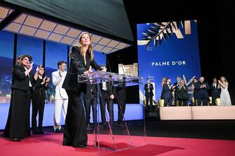 CANNES, FRANCE - MAY 27: Justine Triet receives The Palme D'Or Award for 'Anatomy of a Fall' during the closing ceremony during the 76th annual Cannes film festival at Palais des Festivals on May 27, 2023 in Cannes, France. (Photo by Stephane Cardinale - Corbis/Corbis via Getty Images)