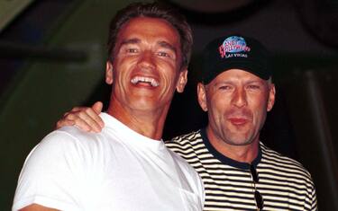 LAS VEGAS, NV - JULY 25, 1994:  (FILE PHOTO)  Actors Arnold Schwarzenegger (L) and actor Bruce Willis attend the opening of Planet Hollywood July 25, 1994 in Las Vegas, Nevada. Schwarzenegger filed candidacy papers for the California governor's race August 9, 2003 in Los Angeles, California.  (Photo by Scott Harrison/Getty Images)