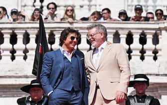 US producer and actor Tom Cruise (L) and US film director Christopher McQuarrie pose at Trinita dei Monti ahead of the premiere of "Mission: Impossible - Dead Reckoning Part One" movie in Rome, on June 19, 2023. (Photo by Tiziana FABI / AFP) (Photo by TIZIANA FABI/AFP via Getty Images)