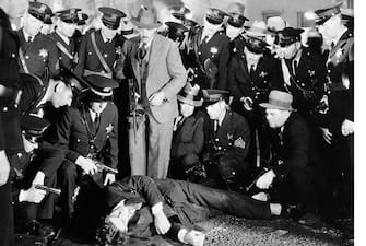 1932: Movie still from the 1932 Howard Hughes gangster film, "Scarface." In this scene, a crowd gathers around Paul Muni, playing the gunned-down mobster. (Photo by �� John Springer Collection/CORBIS/Corbis via Getty Images)