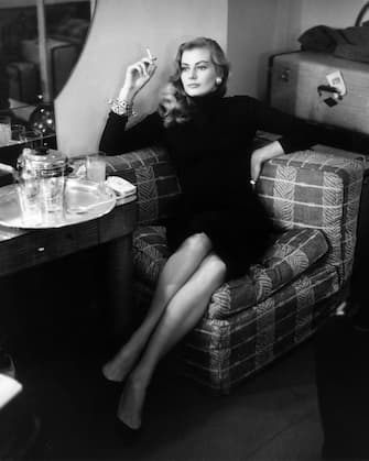 17th November 1955:  Swedish actress Anita Ekberg relaxes with a cigarette in London.  (Photo by Bob Haswell/Express/Getty Images)