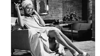 Anita Ekberg wearing only a towel while on the phone in a scene from the film 'Hollywood Or Bust', 1956. (Photo by Paramount/Getty Images)