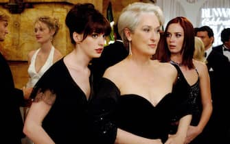 Andy (Anne Hathaway, left) whispers some important information to her boss, fashion magazine editor Miranda Priestly (Meryl Streep), as Miranda's first assistant, Emily (Emily Blunt) looks on.
PHOTOGRAPHS TO BE USED SOLELY FOR ADVERTISING, PROMOTION, PUBLICITY OR REVIEWS OF THIS SPECIFIC MOTION PICTURE AND TO REMAIN THE PROPERTY OF THE STUDIO. NOT FOR SALE OR REDISTRIBUTION.