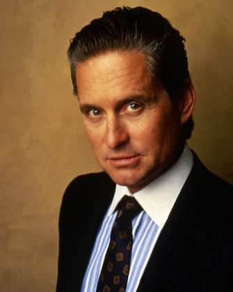 American actor Michael Douglas on the set of Wall Street written and directed by Oliver Stone.  (Photo by Sunset Boulevard / Corbis via Getty Images)
