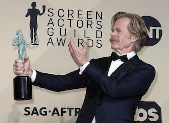 epa07078128 William H. Macy poses with the SAG Award for Best Male Actor in a Comedy Series for 'Shameless' during the 24th annual Screen Actors Guild Awards ceremony at the Shrine Exposition Center in Los Angeles, California, USA, 21 January 2018. The SAG Awards honors the best achievements in film and television performances.  EPA/MIKE NELSON