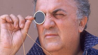 1975: Headshot of Italian film director Federico Fellini (1920-1993) looking thorugh a monocle, on the set of his film, 'Casanova' at Cinecitta Studios, Rome, Italy. (Photo by Santi Visalli Inc./Getty Images)