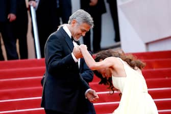 CANNES, FRANCE - MAY 12: George Clooney and Amal Clooney attend the screening of "Money Monster" at the annual 69th Cannes Film Festival at Palais des Festivals on May 12, 2016 in Cannes, France. (Photo by Luca Teuchmann/WireImage)
