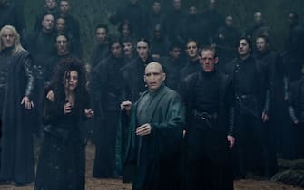 (L-r) JASON ISAACS as Lucius Malfoy, HELENA BONHAM CARTER as Bellatrix Lestrange and RALPH FIENNES as Lord Voldemort in Warner Bros. Pictures’ fantasy adventure “HARRY POTTER AND THE DEATHLY HALLOWS – PART 2,” a Warner Bros. Pictures release.