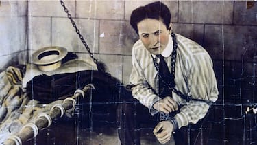 Photographic print, hand coloured, poster format, of Harry Houdini (1874-1926) a Hungarian-American illusionist and stunt performer, noted for his sensational escape acts. (Photo by: Universal History Archive/Universal Images Group via Getty Images)