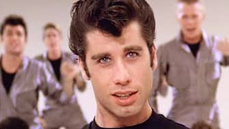 1189257869 LOS ANGELES - JUNE 16: The movie "Grease", directed by Randal Kleiser. Seen here, the musical number, "Greased Lightning," led by John Travolta (front and center) as Danny Zuko. Initial theatrical release of the film, June 16, 1978. Screen capture. Paramount Pictures. (Photo by CBS via Getty Images)