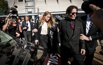 Model, Amber Heard, and her husband, Johnny Depp, leave Southport Magistrates Court, Queensland, April 18, 2016. Heard received a fine for bringing pet dogs, Pistol and Boo, illegally into Australia in 2015. (Photo by Robert Shakespeare/Fairfax Media via Getty Images via Getty Images).