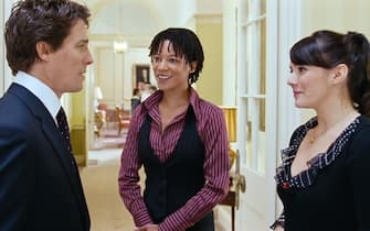 UK.  Hugh Grant , Nina Sosanya and Martine McCutcheon in a scene from the ©Universal Pictures movie : Love Actually (2003). 
Plot: Follows the lives of eight very different couples in dealing with their love lives in various loosely interrelated tales all set during a frantic month before Christmas in London, England. 
Ref:  LMK110-J6851-121020
Supplied by LMKMEDIA. Editorial Only.
Landmark Media is not the copyright owner of these Film or TV stills but provides a service only for recognised Media outlets. pictures@lmkmedia.com