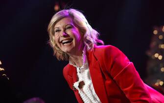 (FILES) In this file photo taken on November 27, 2016 Olivia Newton John performs at the 85th annual Hollywood Christmas parade on Hollywood Boulevard in Hollywood. - Australian singer Olivia Newton-John, who gained worldwide fame as high-school sweetheart Sandy in the hit musical movie "Grease," died on August 8, 2022, her family said. She was 73. The entertainer, whose career spanned more than five decades, devoted much of her time and celebrity to charities after being diagnosed with breast cancer in 1992. (Photo by CHRIS DELMAS / AFP)