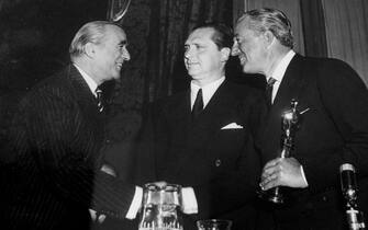 This old picture, which shows Vittorio De Sica (R) who receiving the ''Oscar'' for the movie ''Bicycle Thieves'' (1948) is exposed at Ara Pacis Museeum, in Rome, 07 February 2013. The exhibition will run until 28 April 2013.    ANSA/CLAUDIO PERI