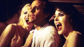 Peter MacNicol is about to be bitten by two female vampires in a scene from the film 'Dracula: Dead And Loving It', 1995. (Photo by Castle Rock/Getty Images)