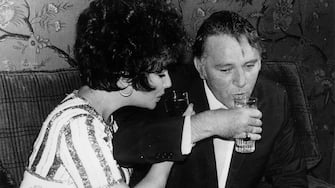 April 1967:  Richard Burton (1925 - 1984) and Elizabeth Taylor at the Hotel du Golf di Valescure shortly after Taylor had won an Best Actress Oscar for her part in 'Who's Afraid of Virginia Woolf'.  (Photo by Keystone/Getty Images)