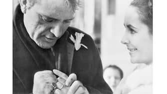 (Original Caption) 03/17/64-Toronto, Canada: Richard Burton and Elizabeth Taylor display thier wedding rings for Toronto photographer. Married in a secret ceremony in Montreal, the famous couple travel to Boston next week for theater engagement of Hamlet, starring the Welch actor.