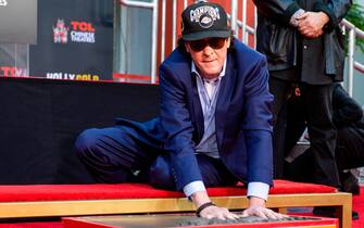 1229644823 Actor Michael Madsen places his hands in cement during his Hand and Footprint Ceremony at TCL Chinese Theatre on November 16, 2020, in Hollywood, California. - The ceremony is the first of its kind held by the TCL Chinese Theatre since the beginning of the coronavirus pandemic. (Photo by VALERIE MACON / AFP) (Photo by VALERIE MACON/AFP via Getty Images)