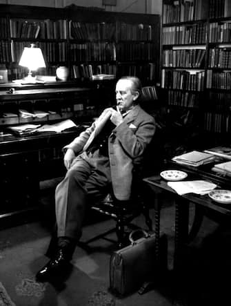 2nd December 1955:  British writer John Ronald Reul Tolkien (1892 - 1973), sitting in his study at Merton College, Oxford, where he is a Fellow. Original Publication: Picture Post - 8464 - Professor J R R Tolkien - unpub.  (Photo by Haywood Magee/Picture Post/Hulton Archive/Getty Images)