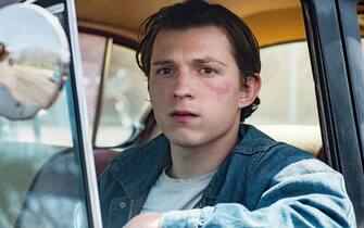USA.  Tom Holland  in the Â©Netflix new film: The Devil All the Time (2020). 
Plot: In the 1960s after World War II in Southern Ohio, bizarre, compelling and mentally disturbed people suffer from the war's psychological damages. 
Ref: LMK106-J6775-250920
Supplied by LMKMEDIA. Editorial Only.
Landmark Media is not the copyright owner of these Film or TV stills but provides a service only for recognised Media outlets. pictures@lmkmedia.com
