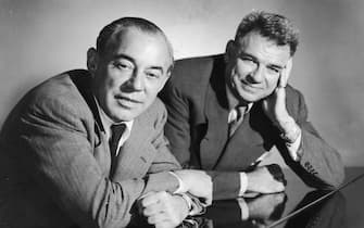 circa 1945:  Studio portrait of American musical team, composer Richard Rodgers (L), (1902 - 1979), and songwriter Oscar Hammerstein (1895 - 1960), leaning over a piano.  (Photo by Hulton Archive/Getty Images)