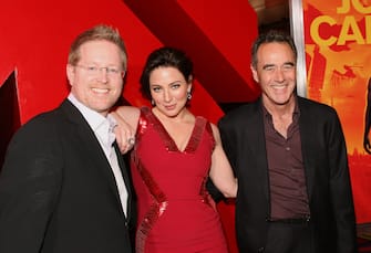 LOS ANGELES, CA - FEBRUARY 22: (L-R) Director/writer Andrew Stanton, actress Lynn Collins and producer Jim Morris arrive at the premiere of Walt Disney Pictures' 'John Carter' held at Regal Cinemas L.A. Live on February 22, 2012 in Los Angeles, California.  (Photo by Jesse Grant/WireImage)