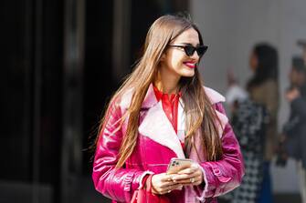 NEW YORK, NEW YORK - FEBRUARY 08: Gabrielle Caunesil wears sunglasses, a pink leather aviator long jacket with wool inner lining, outside Longchamp, during New York Fashion Week Fall-Winter 2020, on February 08, 2020 in New York City. (Photo by Edward Berthelot/Getty Images)