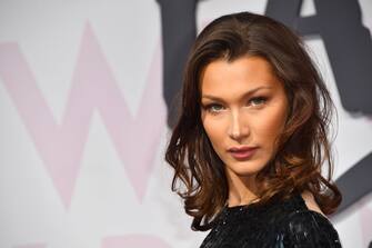US model Bella Hadid poses as she arrives on May 13, 2018 for the Fashion For Relief Cannes 2018 event on the sidelines of the 71st edition of the Cannes Film Festival at Cannes Mandelieu Aeroport, southern France. (Photo by Yann COATSALIOU / AFP)        (Photo credit should read YANN COATSALIOU/AFP via Getty Images)