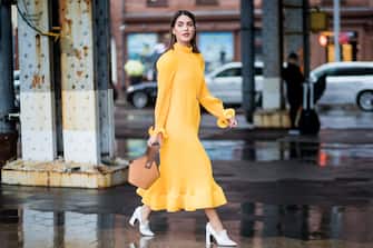 NEW YORK, NY - FEBRUARY 11: A guest wearing yellow dress seen outside Tibi on February 11, 2018 in New York City. (Photo by Christian Vierig/Getty Images)