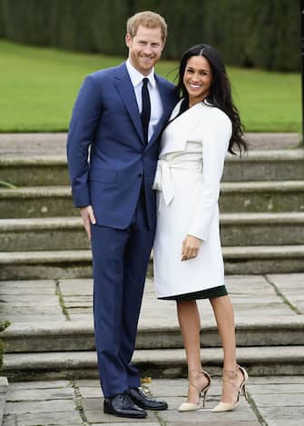 LONDON, ENGLAND - NOVEMBER 27:  Prince Harry (L) and Meghan Markle during an official photocall to announce the engagement of Prince Harry and actress Meghan Markle at The Sunken Gardens at Kensington Palace on November 27, 2017 in London, England.  Prince Harry and Meghan Markle have been a couple officially since November 2016 and are due to marry in Spring 2018.  (Photo by Samir Hussein/Samir Hussein/WireImage)