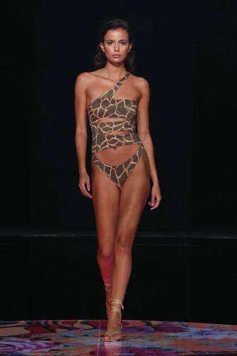GRAN CANARIA, SPAIN â   OCTOBER 24: A model walks the runway during the Miss Bikini Fashion show as during the Gran Canaria Moda Calida Swimwear on October 24, 2020 in Gran Canaria, Spain. (Photo by Estrop/Getty Images)