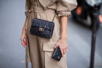 PARIS, FRANCE - SEPTEMBER 23: Alexandra Lapp is seen wearing a beige Frankie Shop jumpsuit, vintage Chanel classic bag, Chanel I-Phone cover during  Paris Fashion Week Womenswear Spring Summer 2020 on September 23, 2019 in Paris, France. (Photo by Christian Vierig/Getty Images)