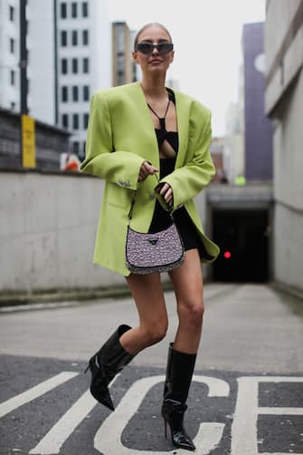 LONDON, ENGLAND - FEBRUARY 19: Leonie Hanne is seen wearing a Mugler Fluorescent Green Blazer with a Prada Silver bag. At Nensi Dojaka, during London Fashion Week February 2022 on February 18, 2022 in London, England. (Photo by Paul Gonzales/Getty Images)