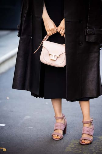 MILAN, ITALY - FEBRUARY 21: Park Min-young, wearing a black dress, black leather coat, pink sandals and nude Tod's bag, is seen outside Tod's show, during Milan Fashion Week Fall/Winter 2020-2021 on February 21, 2020 in Milan, Italy. (Photo by Claudio Lavenia/Getty Images)