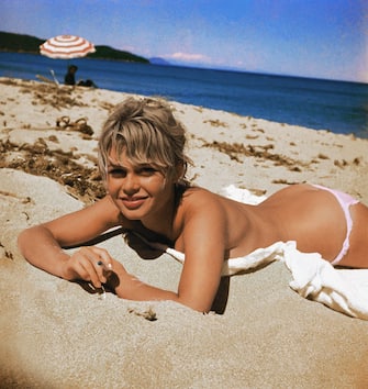 (Original Caption) Brigitte Bardot, originally Camille Javal, actress, pictured here on a towel, sunning on the beach.