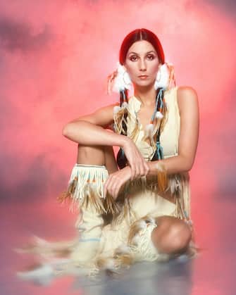 LOS ANGELES - MARCH 21: Singer and actress Cher poses for a photo session in a Bob Mackie blouse on March 21, 1977 in Los Angeles, California.  (Photo by Harry Langdon/Getty Images)
