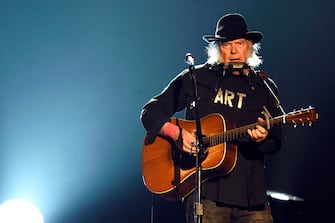 LOS ANGELES, CA - FEBRUARY 06:  Singer Neil Young performs onstage at the 25th anniversary MusiCares 2015 Person Of The Year Gala honoring Bob Dylan at the Los Angeles Convention Center on February 6, 2015 in Los Angeles, California. The annual benefit raises critical funds for MusiCares' Emergency Financial Assistance and Addiction Recovery programs.  (Photo by Frazer Harrison/Getty Images)