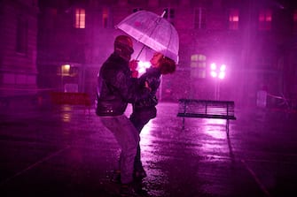 PARIS, FRANCE - AUGUST 02: Visitors dance at the 'Purple Rain' installation at the LycÃ©e Jacques-Decour on August 02, 2020 in Paris, France. Part of Festival Paris l'EtÃ©, the installation by Pierre Ardouvin is a tribute to the song by Prince and allows visitors to role play while equipped with umbrellas and accompanied by the song. (Photo by Kiran Ridley/Getty Images)