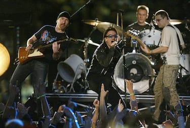 400517 11: Music group U2 performs during halftime of Super Bowl XXXVI February 3, 2002 at the Superdome in New Orleans, LA. Super Bowl XXXVI is being played by the New England Patriots and the St. Louis Rams. (Photo by Jed Jacobsohn/Getty Images)