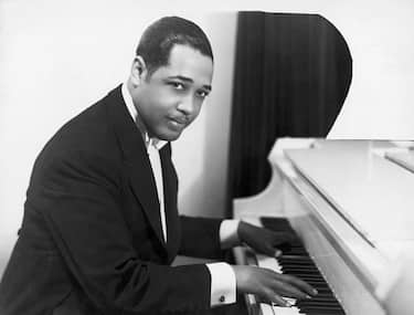 (Original Caption) Duke Ellington (Edward Kennedy; 1889-1974), American composer and arranger, at the keyboard. Half-length photograph, 1910's.