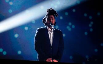 Canadian singer The Weeknd performs via video screen during the Juno Music Awards at Budweiser Gardens in London, Ontario, Canada, on March 17, 2019. (Photo by Lars Hagberg / AFP)        (Photo credit should read LARS HAGBERG/AFP via Getty Images)