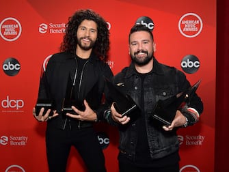 LOS ANGELES, CALIFORNIA - NOVEMBER 22: (L-R) In this image released on November 22, Dan Smyers and Shay Mooney of Dan + Shay pose with the awards for Favorite Country Song, Favorite Country Duo or Group, and Collaboration of the Year at the 2020 American Music Awards at Microsoft Theater on November 22, 2020 in Los Angeles, California. (Photo by Emma McIntyre /AMA2020/Getty Images for dcp)