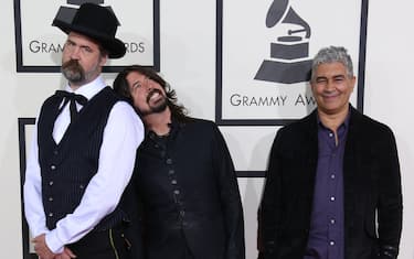 LOS ANGELES, CA - JANUARY 26: Krist Novoselic, Dave Grohl, and Pat Smear arrive at the 56th Annual GRAMMY Awards at Staples Center on January 26, 2014 in Los Angeles, California. (Photo by Dan MacMedan/WireImage)